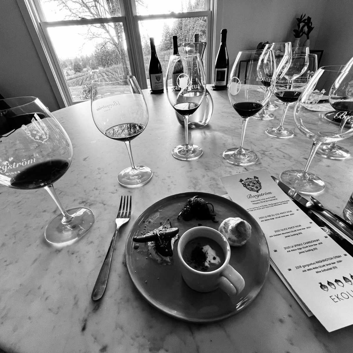 A flight of Willamette Valley wines on a tasting room table